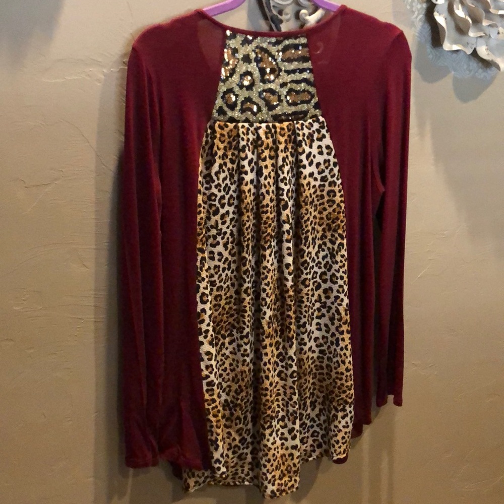 Boutique blouse with leopard sequence